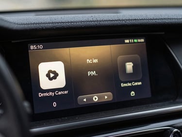 Macro close-up of a premium automotive dashboard display running a custom dark Android UI, soft gold reflections, cinematic side-lighting