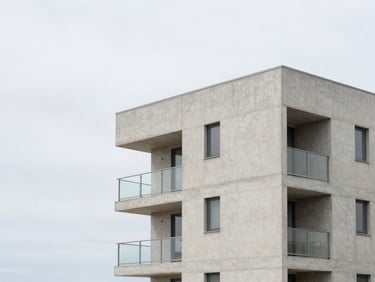 Modern concrete residential building near the coast in Matosinhos, clean geometric lines, soft overcast daylight