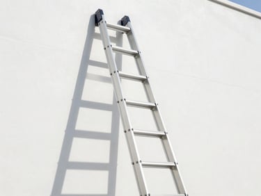 Low-angle architectural shot looking up at a pristine aluminum industrial extension ladder leaning against a clean white concrete wall, sharp midday daylight, clean shadows, technical precision