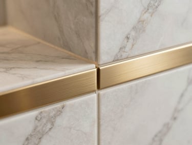 Close-up detail shot of a premium marble tile joint with a brushed champagne-gold metal inlay, flawless alignment, soft warm lighting, luxury interior craftsmanship