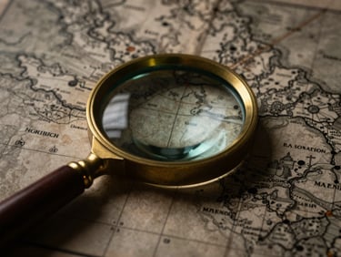 Close-up of a vintage brass magnifying glass resting on a detailed game map printed on aged parchment, dramatic low-key lighting, deep shadows, macro lens