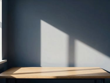 Minimalist clean workspace with natural window light casting deep shadows, serene and professional atmosphere