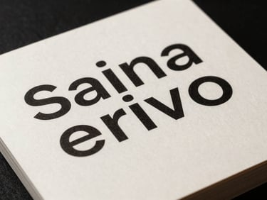 Straight-on macro shot of a minimalist brand identity book, bold Swiss typography on warm-white paper, sharp shadows