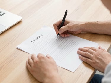 Hands of a co-parent signing organized legal documents on a modern oak desk, bright natural daylight, soft shadows, 35mm lens