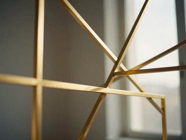 Abstract geometric gold structures interlocking, subtle data representation, ivory and dark gray tones, warm studio lighting, shallow depth of field, 35mm
