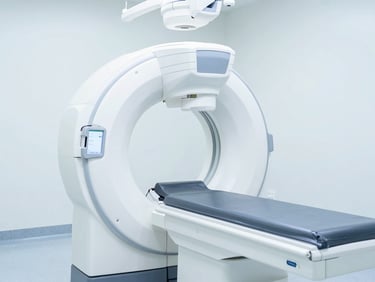 Bright high-key clinical photography of a modern radiology diagnostic suite, clean white and blue tones, sharp focus, 50mm