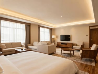 Spacious family hotel suite with interconnected rooms, elegant seating area, and bright lighting