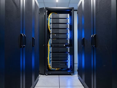 Symmetrical wide angle shot of a clean, high-end corporate server room, cool-toned blue rim lighting, perfectly managed cables, representing absolute structural stability.