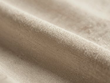 Macro close-up of heavy-weight slub cotton fabric weave, showing rich tactile texture and natural slubs, soft side lighting, shallow depth of field.