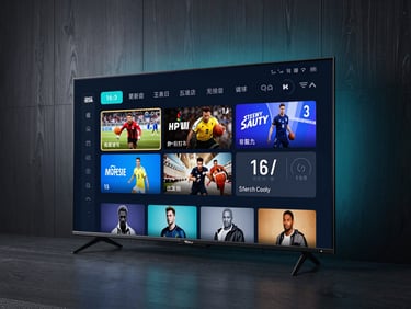 Sleek modern smart TV interface displaying a clean dark-themed channel guide with sports and movie categories, soft cyan ambient light reflecting on a dark wooden wall, wide 16:9 cinematic shot.