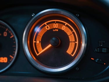 Dashboard warning light for engine or DPF, illuminated in orange, moody industrial lighting, high contrast.