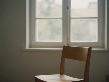 Cozy minimalist room interior with warm morning window light illuminating a wooden chair, peaceful atmosphere