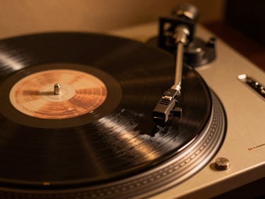 Close-up of vinyl record grooves spinning on a turntable, warm low-key studio lighting, shallow depth of field, 35mm