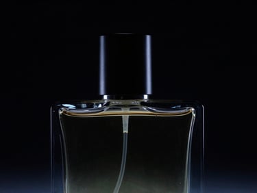 Close-up of a sleek, dark perfume bottle catching sharp directional light against a deep black background, subtle neon backlighting, futuristic dark aesthetic, 35mm.