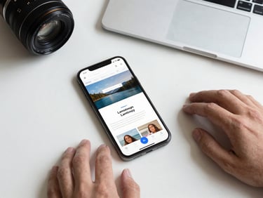Overhead flat-lay of a smartphone and notebook on a white desk, hands typing, studio light, sharp focus on the device screen showing a landing page