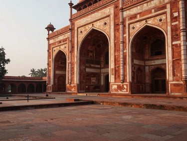 A quiet courtyard of Humayun's Tomb in Delhi, intricate red sandstone arches, soft morning light, uncrowded perspective, warm editorial travel photography