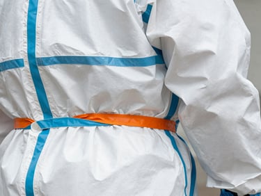 Detail shot of a chemical protection suit's sealed seam and material texture, high-contrast, technical detail.