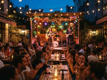 Wide-angle editorial photograph of a vibrant outdoor restaurant stage at dusk, musicians performing under warm glowing festoon lights, energetic crowd, shallow depth of field, 35mm