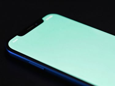Macro close-up of a physical Android screen displaying a sleek mint green vector UI mockup, dark studio background, high contrast, neon rim lighting.