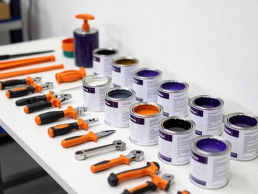 Assortment of industrial hardware tools and paint cans, organized on a clean workbench, bright workshop lighting, high contrast, eye-level shot.