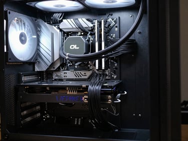 Wide shot of a completed custom PC rig with clean cable management, cool technical lighting, shallow depth of field, 50mm