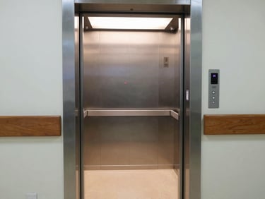 Technician in clean uniform inspecting a heavy-duty industrial freight elevator guide rail with precision tools, technical lighting
