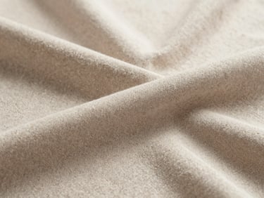 Close-up of high-quality hosiery fabric, showing intricate weave and soft texture, under natural light.
