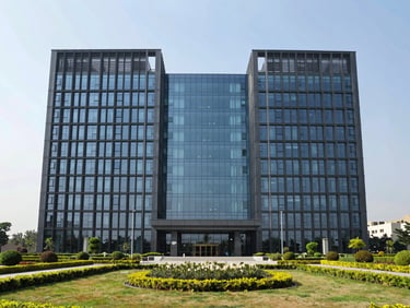 Symmetrical architectural elevation of a modern glass and steel corporate headquarters in Mohali, bright daylight, manicured landscaping in foreground