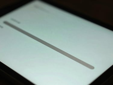 Extreme close-up of a custom media player interface, glowing silver progress bar on an obsidian screen, shallow depth of field