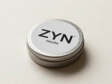 Studio product flat of ZYN nicotine pouch tin on a soft cream surface, overhead diffuse lighting, clean cylindrical tin with label detail crisp, minimal background, quiet shadow beneath the tin