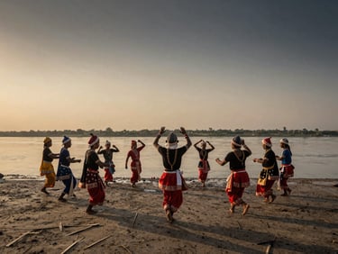 Cinematic wide-angle shot of traditional Bihu dancers on the banks of the Brahmaputra river, dramatic sunset lighting, high-contrast natural shadows.