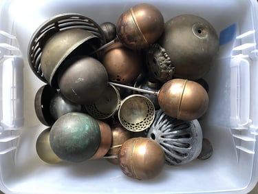 Metal parts in a sculptor's workshop bin, image 8.