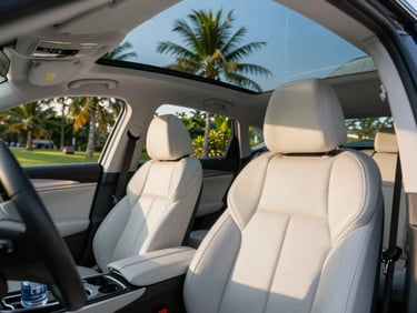 Interior of a clean modern sedan with pristine leather seats, a cold bottle of water visible in the console, bright clear daylight, professional travel editorial style