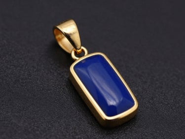 Macro product photography of a finished gold pendant with deep royal blue hot enamel inlay in precise channels, sharp highlights, deep black background