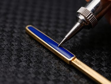 Macro shot of a jeweler applying deep blue hot enamel into a precise gold channel, sharp metallic edges, 85mm lens