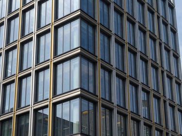 Sharp architectural photography, bright daylight, modern corporate building facade with glass and steel, clean lines, high-contrast, sora font vibe, 35mm