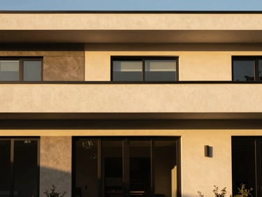 Golden-hour architectural photo of a modern home exterior, clean lines, warm natural light, 35mm.