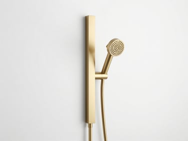 Minimalist thermostatic shower column in brushed gold, crisp metallic highlights, clean studio setting, white background