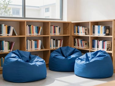 Cozy school library corner with wooden shelves filled with books, comfortable blue beanbags, bright window light