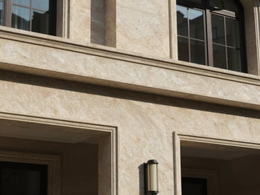 Architectural detail of a luxury residential villa facade, travertine stone, warm lighting, clean lines.