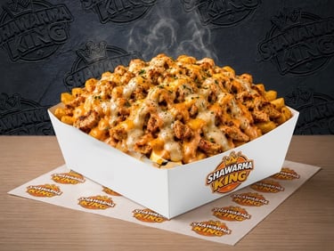A steaming box of Shawarma King loaded fries topped with chicken and melted cheese sauce.