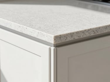 Close-up architectural shot of a flawless quartz countertop corner meeting custom cabinets, natural side daylight, crisp clean miter joints, raw textures.
