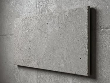 Close-up of textured wall cladding panel installed flush on a concrete wall, studio strobe lighting revealing surface relief and matte finish detail, cool neutral background, architectural product photography
