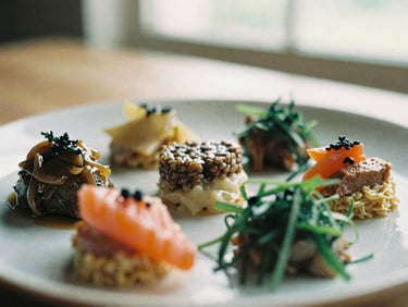 Close-up of a beautifully plated artisanal dish, featuring fresh, vibrant ingredients, soft natural window light, shallow depth of field, warm editorial photography, rich earthy tones, 35mm film