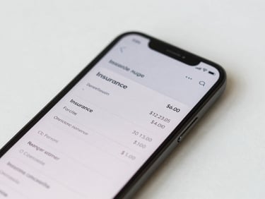 Close-up of a mobile phone screen displaying a clean insurance quote confirmation screen with price figure visible, flat-lay on white surface, bright daylight, no faces, minimalist composition
