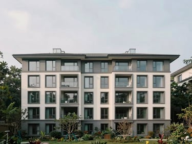 Sweeping environmental shot of a modern architectural estate facade nestled into a quiet forest edge, overcast daylight, architectural framing, muted natural tones.