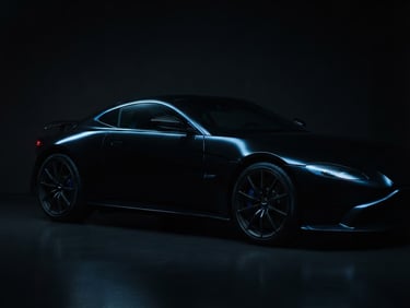 Dramatic low-key studio shot of a polished luxury sports car silhouette, sharp metallic blue key lights tracing the aerodynamic contours, deep graphite background, 35mm