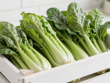 Crisp macro editorial shot of fresh organic vegetables in a clean white wooden crate, bright natural morning light, sharp focus, 50mm