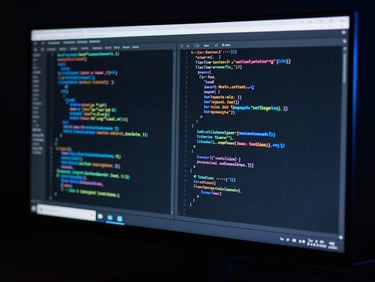 Moody cinematic technology photography, low-key dark studio lighting, sleek computer monitor displaying code syntax with electric blue accent rim light, sharp details, 50mm lens