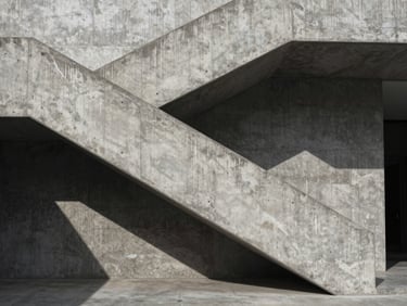 Stark concrete staircase, sharp diagonal shadows, overcast light, high-contrast brutalist architectural detail.
